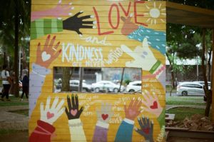 A wall with different principles written on it such as love and kindness.